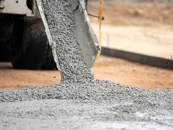pouring wet cement on road